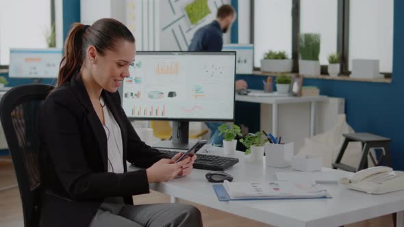 Corporate Employee Looking at Smartphone Screen