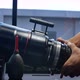 Human hands are rotating the focusing system of the big movie camera zoom lens. - VideoHive Item for Sale