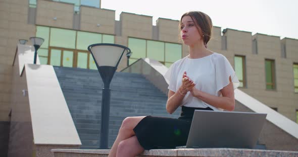 Young Businesswoman During an Online Video Call Communicates Via Video Communication Through a