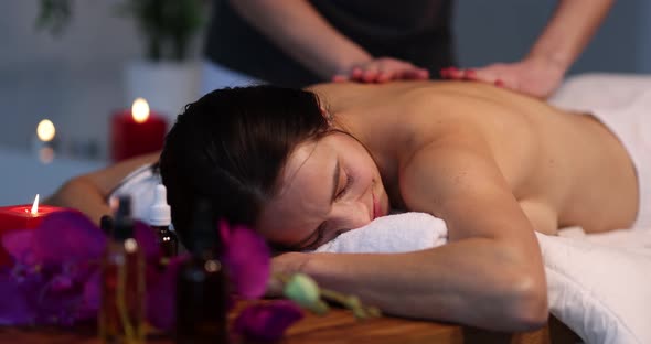Masseuse Makes Back Massage in Spa Salon