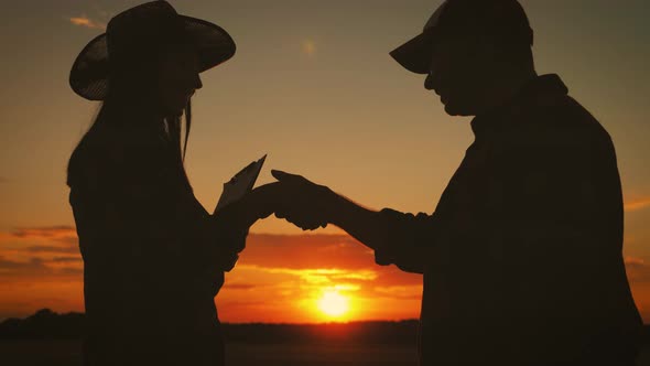 Farmers Handshake Over the Wheat Crop in Harvest Time. Partnership Concept.