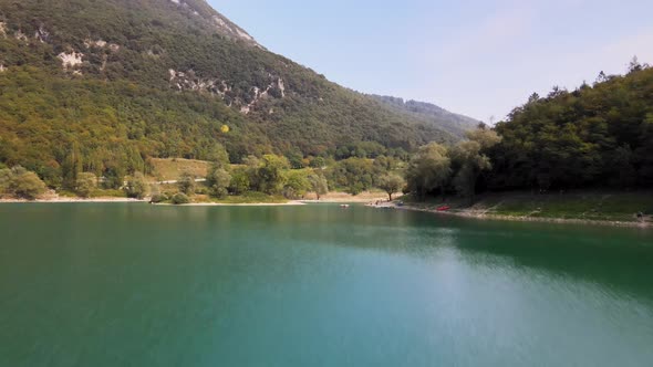 Aerial View of Lago di Tenno, Trentino Province, North Italy. Flying Above Green Water on Sunny Summ