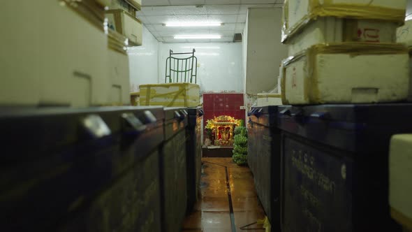 Stocks Of Fresh Goods In Sealed Boxes And Bunches Of Unripe Bananas In Storage Room With Spirit