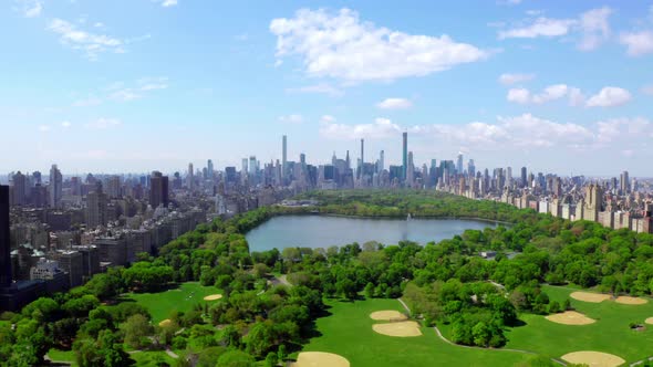 Aerial  Video Above Green Central Park in the Middle of Manhattan New York