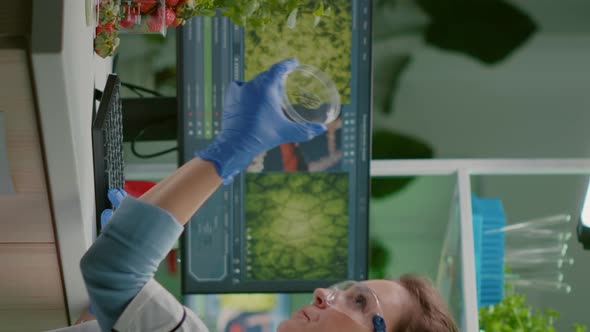 Vertical Video Botanist Researcher Typing Medical Expertise on Computer