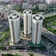 Flying a Copter Around Three Modern Buildings Against the Backdrop of the City - VideoHive Item for Sale