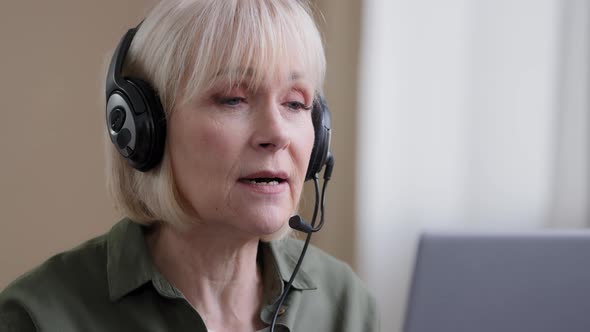 Close Up Senior Caucasian Wrinkled Businesswoman Mature Lady Online Teacher in Headset Class Lesson