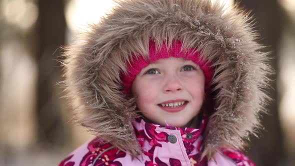 A Girl Smiles in Winter and Spends a Good Day Portrait