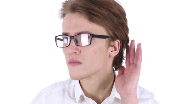 Young Handsome Man in Glasses Listening Secret White Background