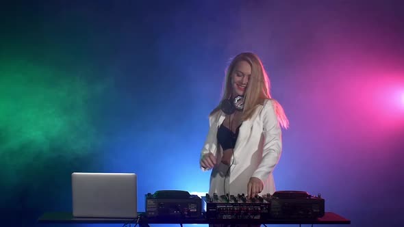 Beautiful, Funny, Smiling, Sexy Dj Girl in White Jacket, Headphones Playing Music and Dancing