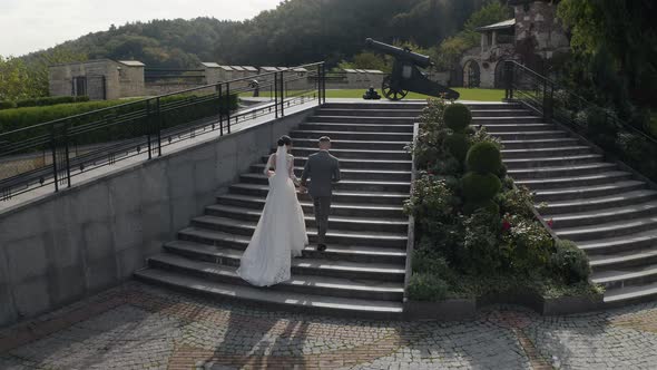 Lovely Newlyweds Caucasian Bride Groom Walking in Park Holding Hands Wedding Couple Family