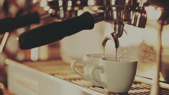 Barista Making a Cup of Strong Coffee in a Coffee Machine