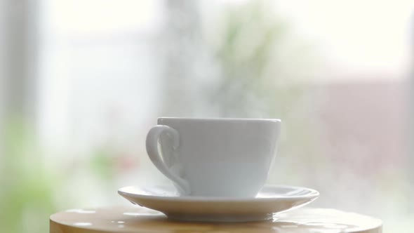 A Sugar Cube Falls Into A Coffee Cup And Splashes Scatter And Steam Goes