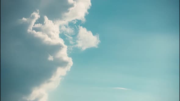 Closeup Fluffy White Clouds Moving Fast Changing to Clear Sky in Timelapse