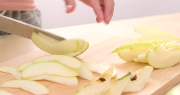 Cutting apple on the cutting board