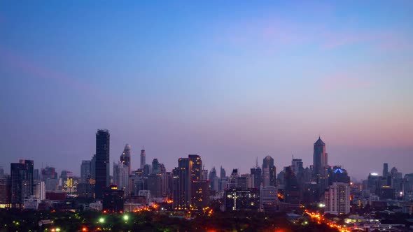 Day and night transition time lapse of cityscape and buildings in metropolis