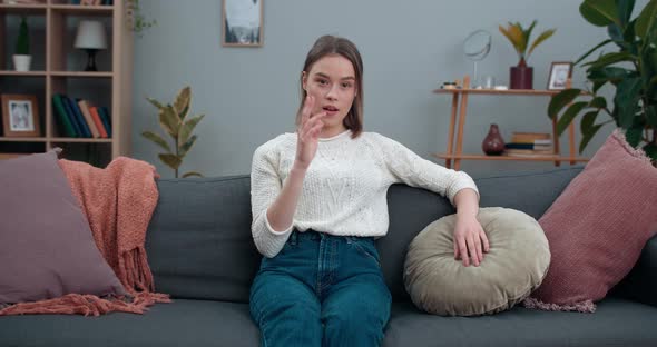 Young Pretty Woman Showing with Deafmute Sign Language Go Vegan and Looking To Camera