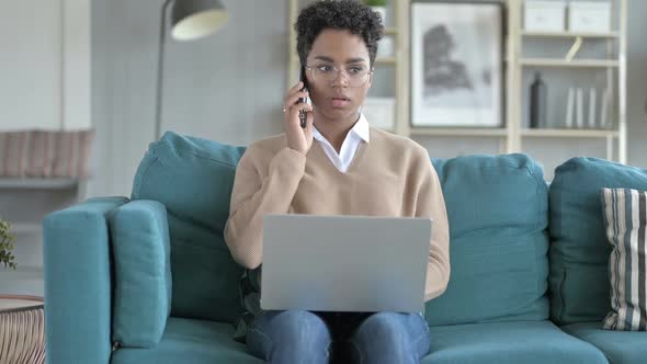 Working Young African Girl Talking on The Phone