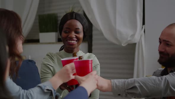 Mixed Race Friends Socializing While Sharing Socia Media Advice Relaxing on Sofa