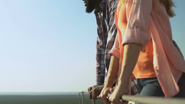 Multiethnic Man and Woman Spending Time Together on Roof of Building, Date