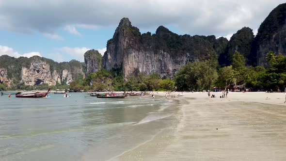 People relaxing on the beach of Railay Beach in AO Nang in Thailand