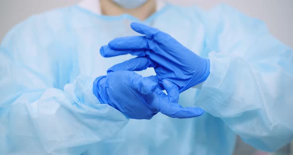 Doctor Pulls Off Protective Gloves Coronavirus - Covid-19 Concept