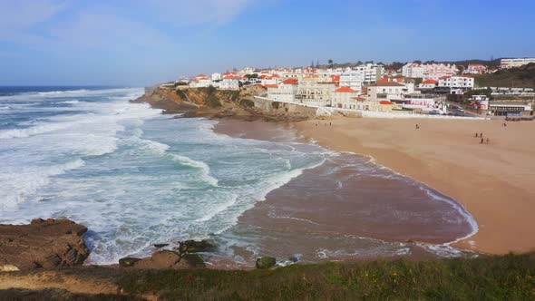 Aerial Drone View of Sandy Beach at Lisbon, Portugal at Praia das Macas, a Beautiful Coastal Town on