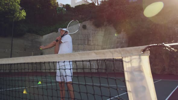 Man playing tennis on a sunny day