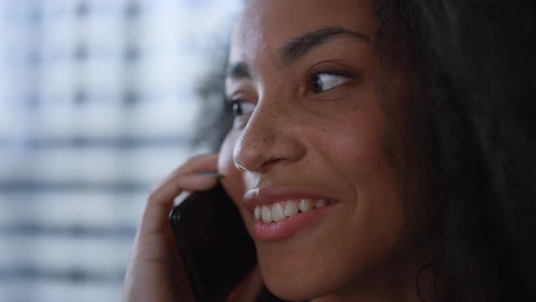 American Businesswoman Talking Mobile Phone in Office Indoors