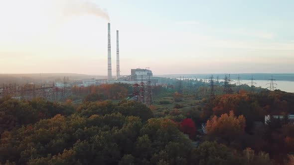 view of the territory of the power plant with power lines on the background of the river