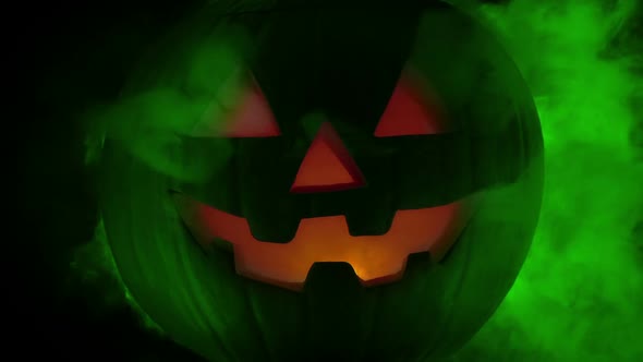 Green Smoke Rushing Out Of Halloween Pumpkin