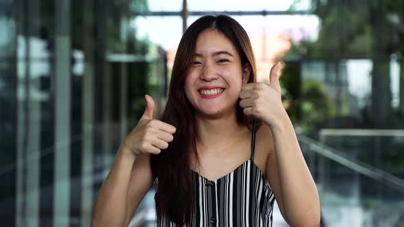 Excited Ethnic Woman Showing Thumbs Up