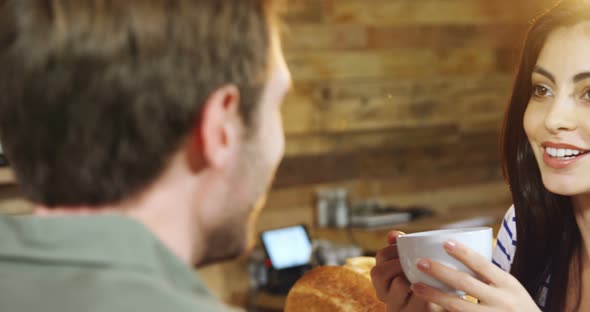 Couple having coffee in cafe 4k