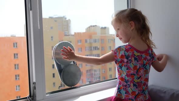 Girl Playing with Robot Window Cleaner