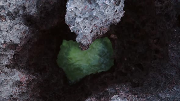 Heart shaped turquoise ocean water view from above some rocks, in Watamu Beach, Kenya