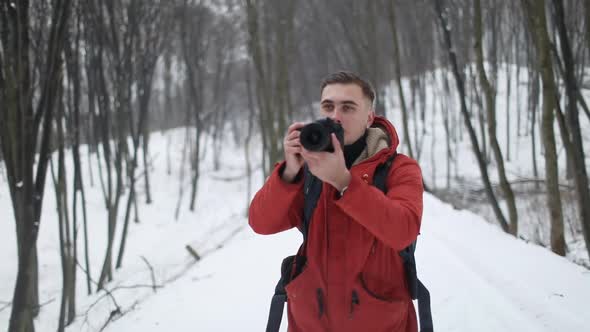 Photographer Taking Photo in Forest