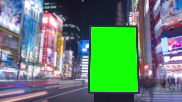 Green Screen Billboard on a Defocused Crossroad with Neon Lights, Cyberpunk Colors, Timelapse of