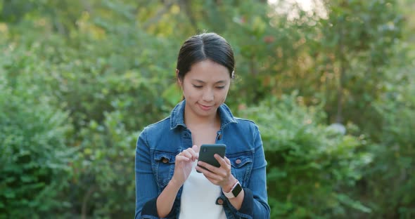 Woman use of mobile phone at outdoor