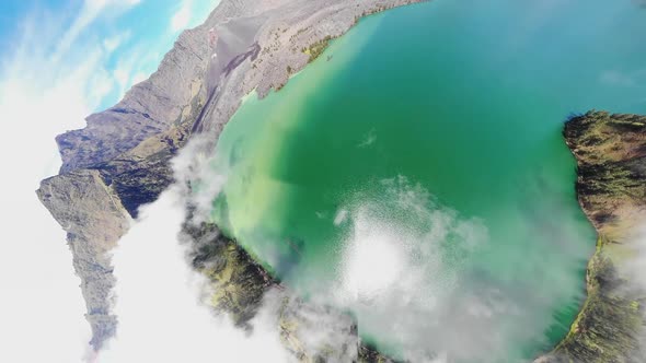 Aerial video of low laying clouds over Mount Rinjani in Indonesia (2)