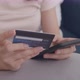 Young Asian Woman hand holding credit card using a digital mobile device and Buying online - VideoHive Item for Sale
