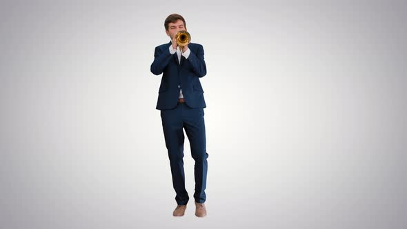 Man in Suit Standing Playing Trumpet on Gradient Background