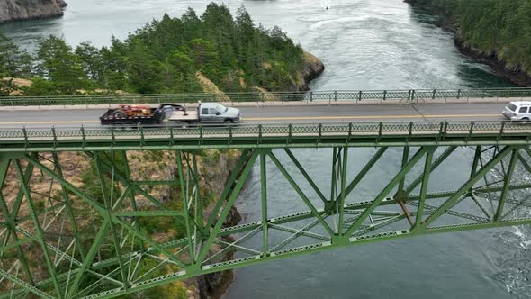 Aerial view pulling away from the bridge at Deception Pass State Park.