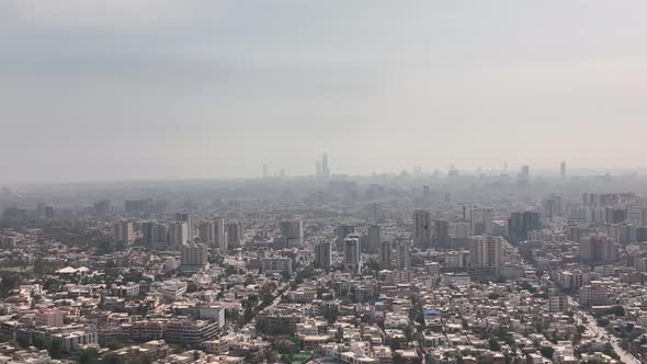 Aerial View Over Karachi Skyline In Pakistan With Haze Seen In The Distance. Dolly Left