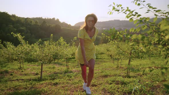 Joyful Woman Running in the Countryside