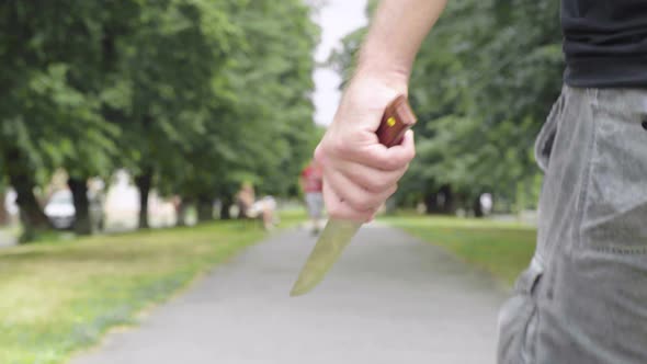 Maniac with a Knife in His Hand