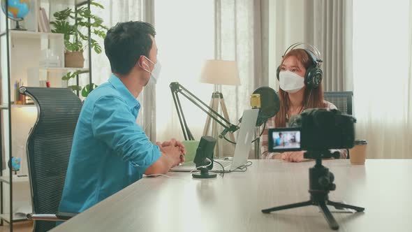 Wearing Protect Mask, Camera Recording Of Asian Man Host Record Podcast With Laptop Interview Guest