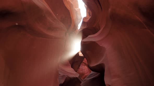 Antelope Canyon With Wavy And Smooth Stone Walls Of Red Color And Sun Ray Shines