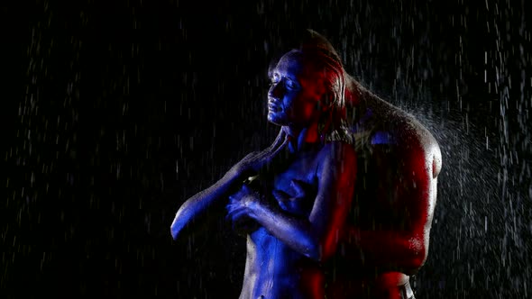 Sexy Naked Lovers in Rain in Night Handsome Brawny Man is Hugging His Seductive Girlfriend