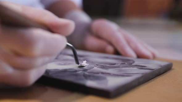 Chocolate Art. Closeup Of Cutting Picture On Handmade Chocolate