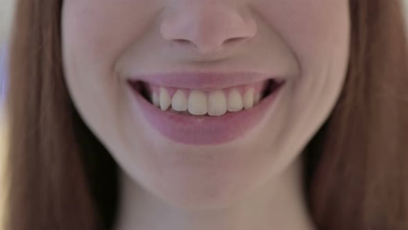 Close Up of Mouth of Smiling White Woman at Camera